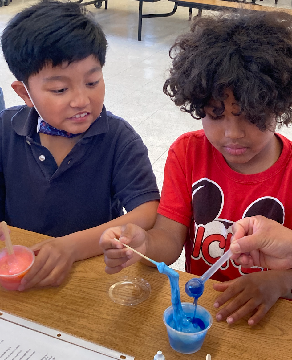 Los Cerritos third and fourth graders learn how to concoct slime at the school's science festival on May 5, 2023.